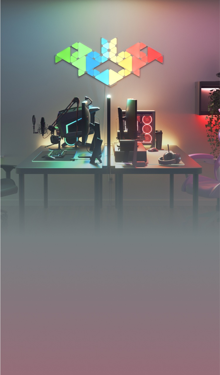 책상과 모니터 위에 Nanoleaf Lines RGB 조명으로 연출하는 사무실 겸 침실 환경. PC 배틀스테이션을 위한 완벽한 게임 조명.