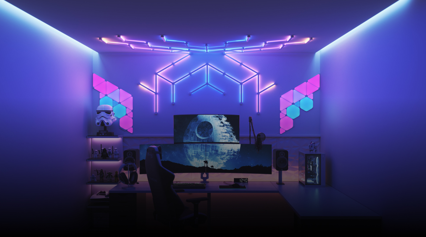 Tata set gim gaya Futuristik dengan lampu pintar RGB pencahayaan rumah pintar Nanoleaf di atas monitor PC. Lampu yang wajib dimiliki untuk setiap gamer.