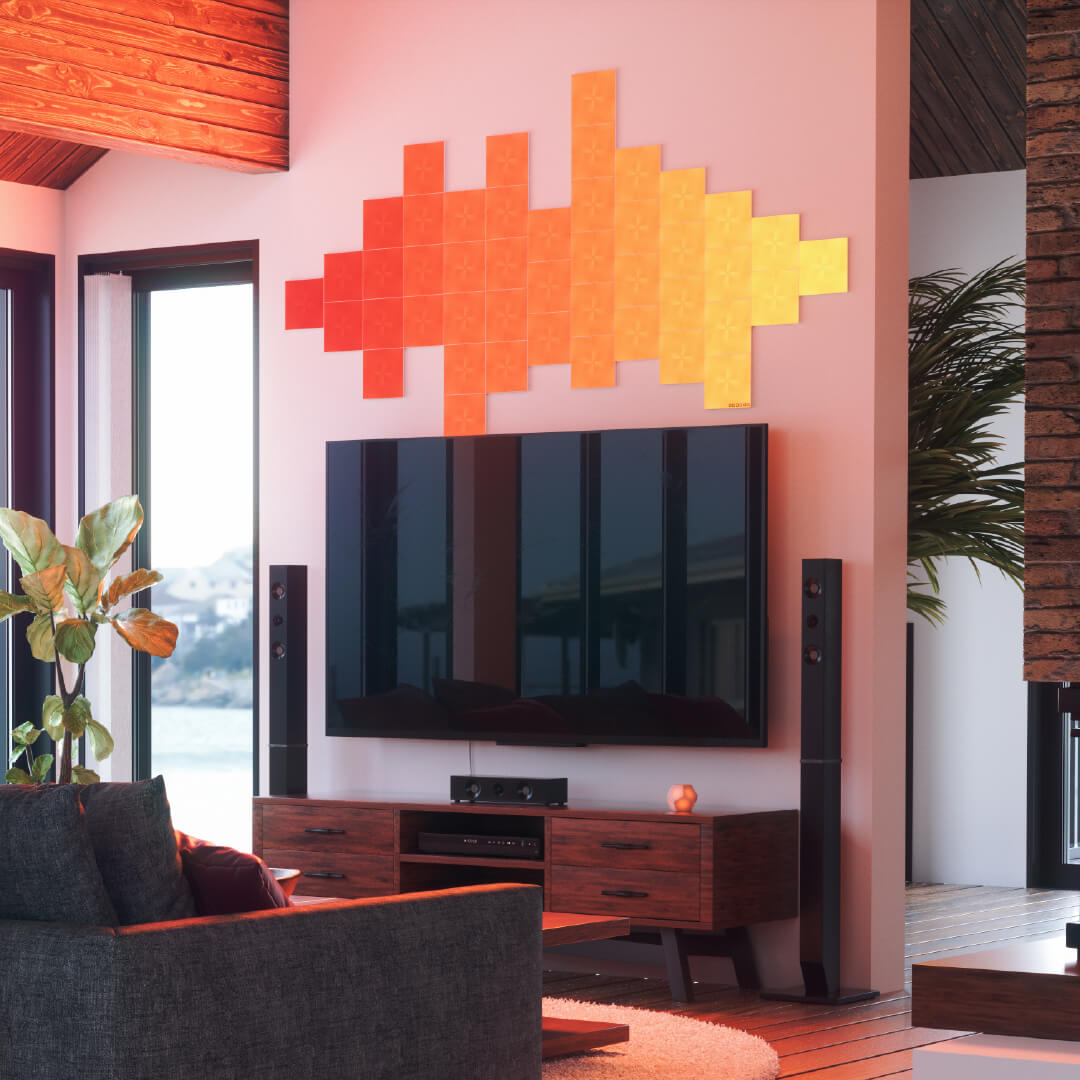 Ô đèn thông minh dạng mô-đun hình vuông có thể thay đổi màu sắc Nanoleaf Canvas được gắn lên tường trong phòng khách. Tương tự với Philips Hue, Lifx. HomeKit, Google Assistant, Amazon Alexa, IFTTT. 