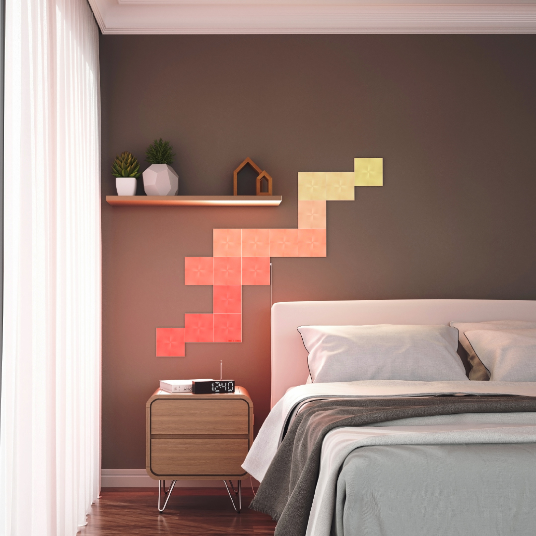 Ô đèn thông minh dạng môđun hình vuông có thể thay đổi màu sắc Nanoleaf Canvas được gắn lên tường trong phòng ngủ. Tương tự với Philips Hue, Lifx. HomeKit, Trợ lý Google, Amazon Alexa, IFTTT.
