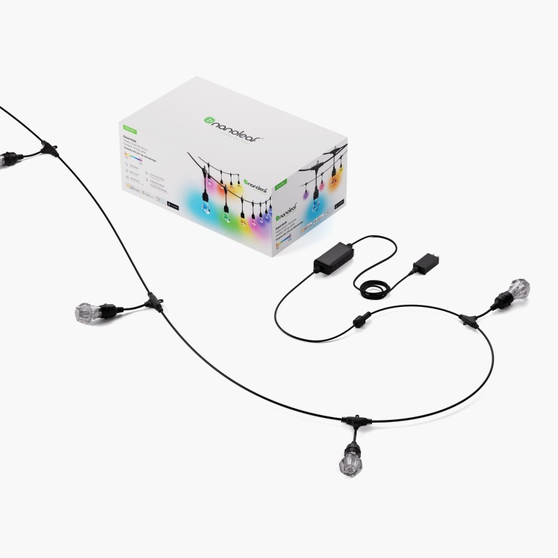 Nanoleaf Smart Multicolored Outdoor String Lights product box with a white background. Beside it, the product is partially displayed, featuring a black cord, two LED bulbs, the outdoor string lights controller, and the power supply unit.